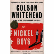 Three paperback books from Colson Whitehead's collection including The Nickel Boys, The Underground Railroad, and The Colossus of New York.