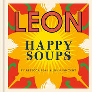 Two hardcover cookbooks from the Leon Happy Curries and Happy Soups collection by Rebecca Seal and John Vincent, displayed on a shelf.