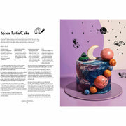 Open hardcover of "Baking With Kim-Joy" cookbook showing colorful, creative baked goods and whimsical illustrations by Kim-Joy.
