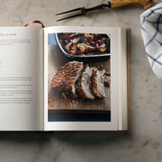 Hardback copy of Ginger Pig Meat Book by Tim Wilson & Fran Warde, featuring meat buying, preparation, and cooking tips.