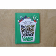 Hardback copy of The Veggie Chinese Takeaway Cookbook by Kwoklyn Wan featuring colorful dish images and Asian-inspired recipes