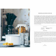 Hardcover of "Simply Living Well" by Julia Watkins, a guide to creating a natural, low-waste home with eco-friendly lifestyle tips.