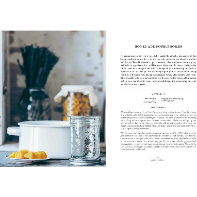Hardcover of "Simply Living Well" by Julia Watkins, a guide to creating a natural, low-waste home with eco-friendly lifestyle tips.