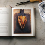 Hardcover of Ginger Pig Meat Book by Tim Wilson and Fran Warde, featuring meat cuts and cooking tips from Mitchell Beazley.