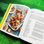 Hardcover book titled "Original Flava: Caribbean Recipes From Home" by Craig McAnuff, featuring colorful cover art with Caribbean culinary themes.