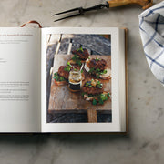 Hardcover of Ginger Pig Meat Book by Tim Wilson & Fran Warde, featuring meat cuts and cooking tips from Mitchell Beazley.