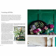 Hardcover book titled "In Bloom" by Clare Nolan, featuring colorful flower arrangements on the cover.
