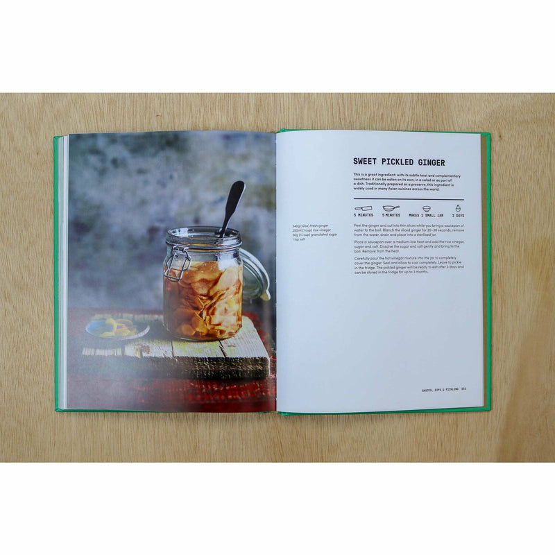 Hardback copy of The Veggie Chinese Takeaway Cookbook by Kwoklyn Wan, featuring colorful dish photographs and a wok on the cover.