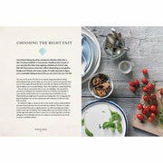 Paperback of "Fast Your Way to Wellness" by Lee Holmes, featuring the book cover with colorful design and title text.