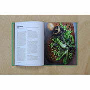 Hardback copy of The Veggie Chinese Takeaway Cookbook by Kwoklyn Wan, featuring colorful vegetable dishes and wok cooking techniques.