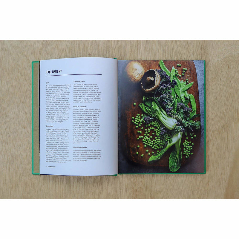 Hardback copy of The Veggie Chinese Takeaway Cookbook by Kwoklyn Wan, featuring colorful vegetable dishes and wok cooking techniques.