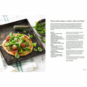 Paperback copy of Supercharged Food by Lee Holmes, featuring colorful cover art and a healthy eating theme.