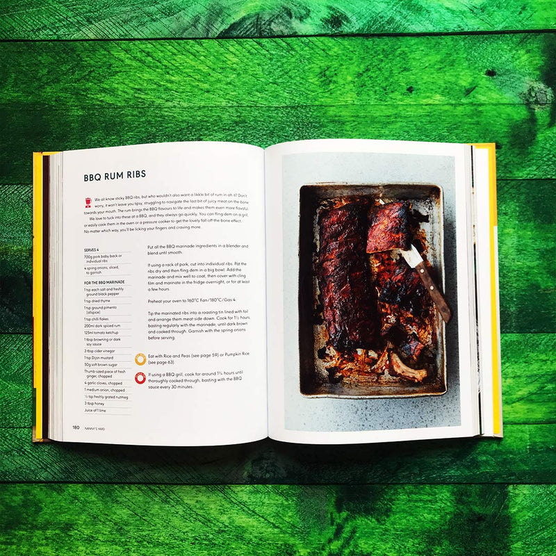 Hardcover of "Original Flava: Caribbean Recipes From Home" by Craig McAnuff, featuring vibrant Caribbean dishes on the cover.