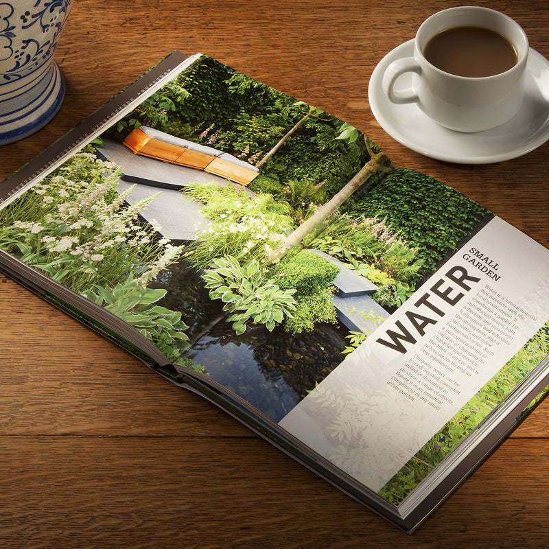 Hardcover copy of RHS Small Garden Handbook by Andrew Wilson, featuring tips for maximizing outdoor garden space.