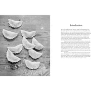 Hardcover copy of "Anna Del Conte on Pasta" by Anna Del Conte, featuring a close-up of the book cover with pasta illustrations.