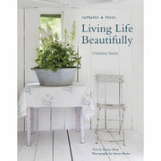 Hardcover book "Living Life Beautifully" by Christina Strutt with Nancy Alsop, non-fiction, CICO Books, featuring elegant cover design.