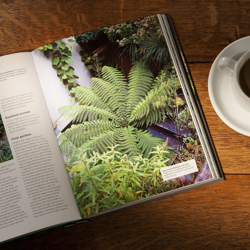 Hardcover RHS Small Garden Handbook by Andrew Wilson, showcasing tips for maximizing outdoor space with garden design ideas.