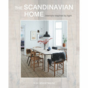 Hardcover of "The Scandinavian Home" by Niki Brantmark, featuring light-inspired interior design and Scandinavian decor.