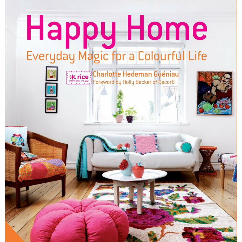 Hardcover book titled "Happy Home: Everyday Magic for a Colourful Home" by Charlotte Hedeman Gueniau and Holly Becker, featuring colorful home decor.
