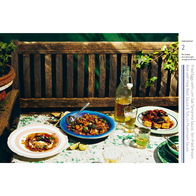 Hardcover of Rosa's Thai Cafe Vegetarian Cookbook by Saiphin Moore, featuring vibrant Thai dish photos on the cover.