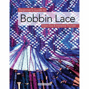 Book cover of "Beginner's Guide to Needlecrafts" by Gilian Dye, featuring images of bobbin lace, scarves, and purses on a paperback.