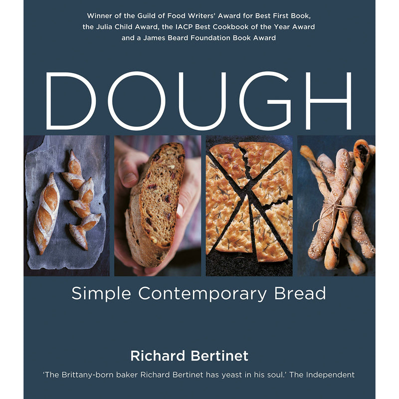 Sourdough bread dough in a bowl with flour on a wooden surface, from The Sourdough School books by Richard Bertinet and Vanessa Kimbell.